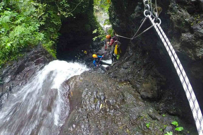 5Hrs Advanced Canyoning (50m) 12 Rappels (Pickup, Lunch & GoPro) - Three slides and nine jumps through the canyon