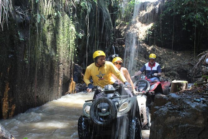Bali Atv Riding through Cave and Waterfall - Getting ready with a helmet and gum boots