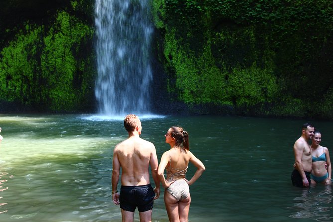 Bali Quad Adventure with Waterfall Tour - Kanto Lampo, water over dark rock
