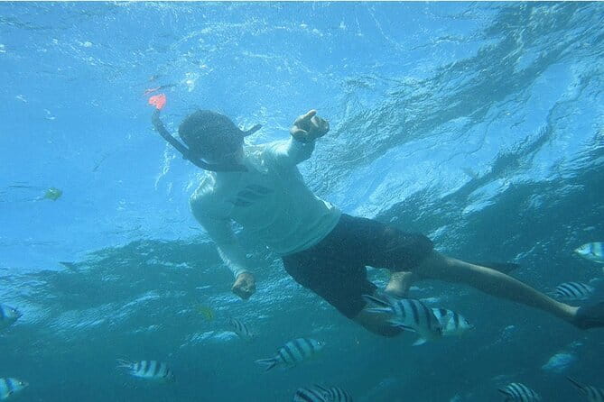 Blue Lagoon Snorkeling with Lunch and Private Transport - Boarding the traditional boat