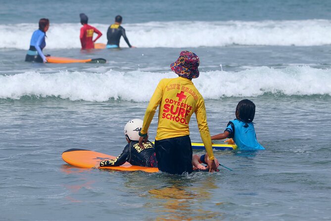 Surf Lesson with a Personal Instructor at Kuta Beach - Getting fitted with the board and safety gear
