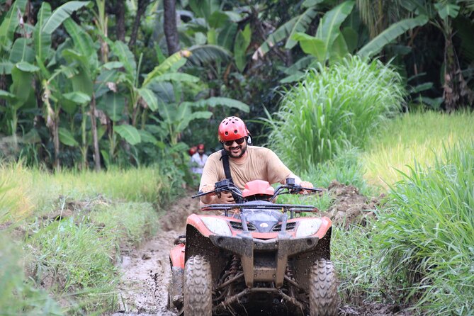 Ubud ATV Quad Bike with Ayung River Rafting Experience - ATV riding through rice fields and waterfalls